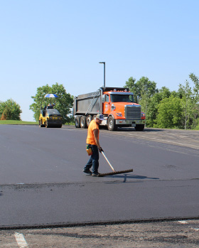 Johnson and Sons Paving a Parking Lot