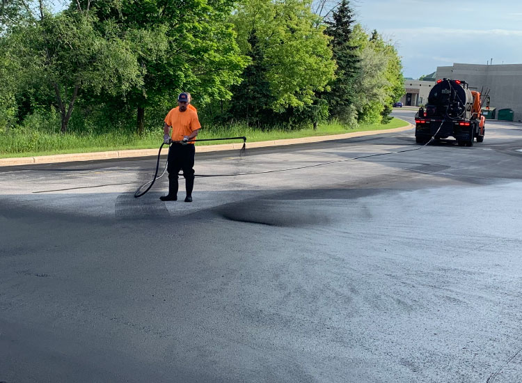 Asphalt Sealcoating, Patching, & Striping